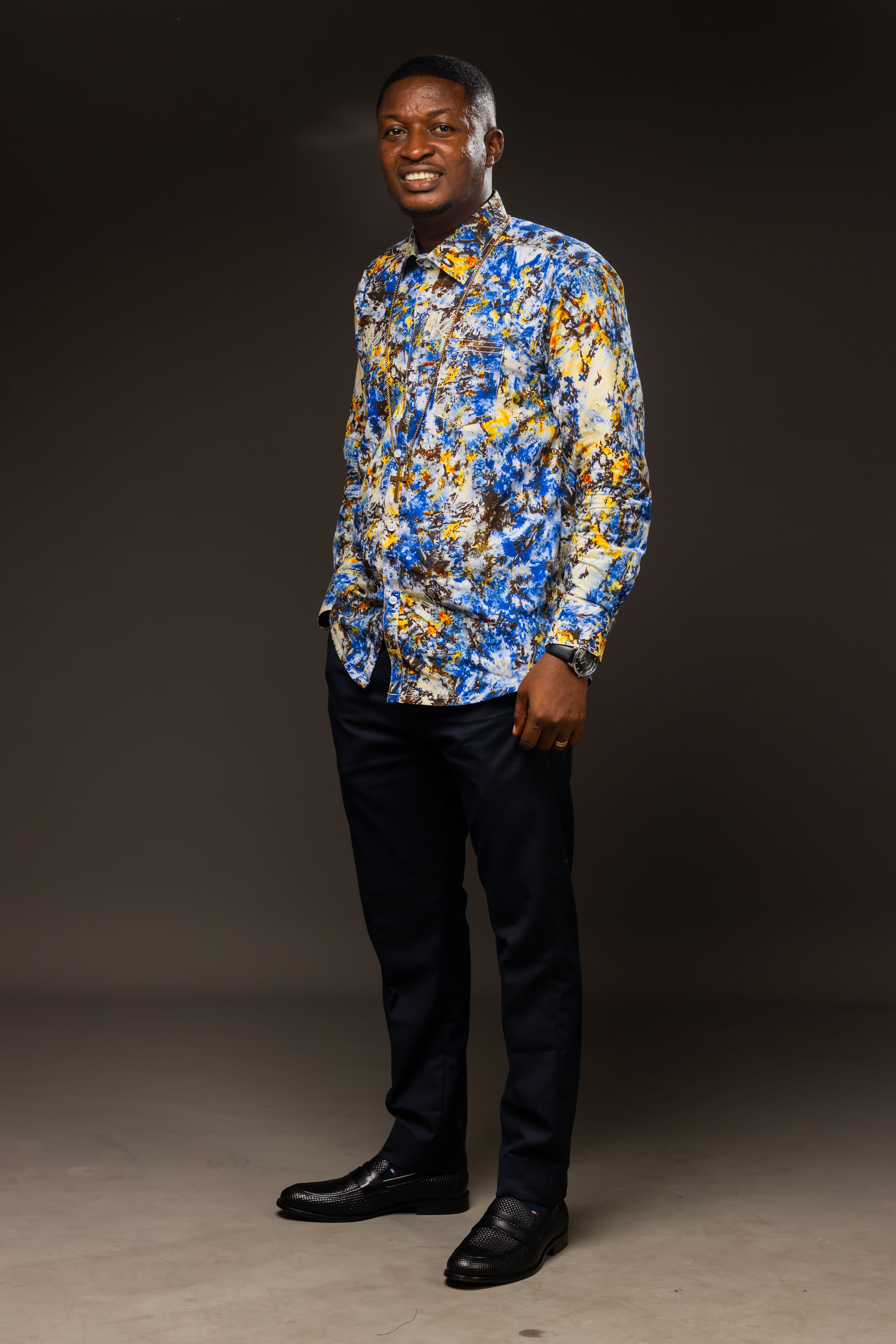 Rev. Theophilus Badger in vibrant patterned shirt