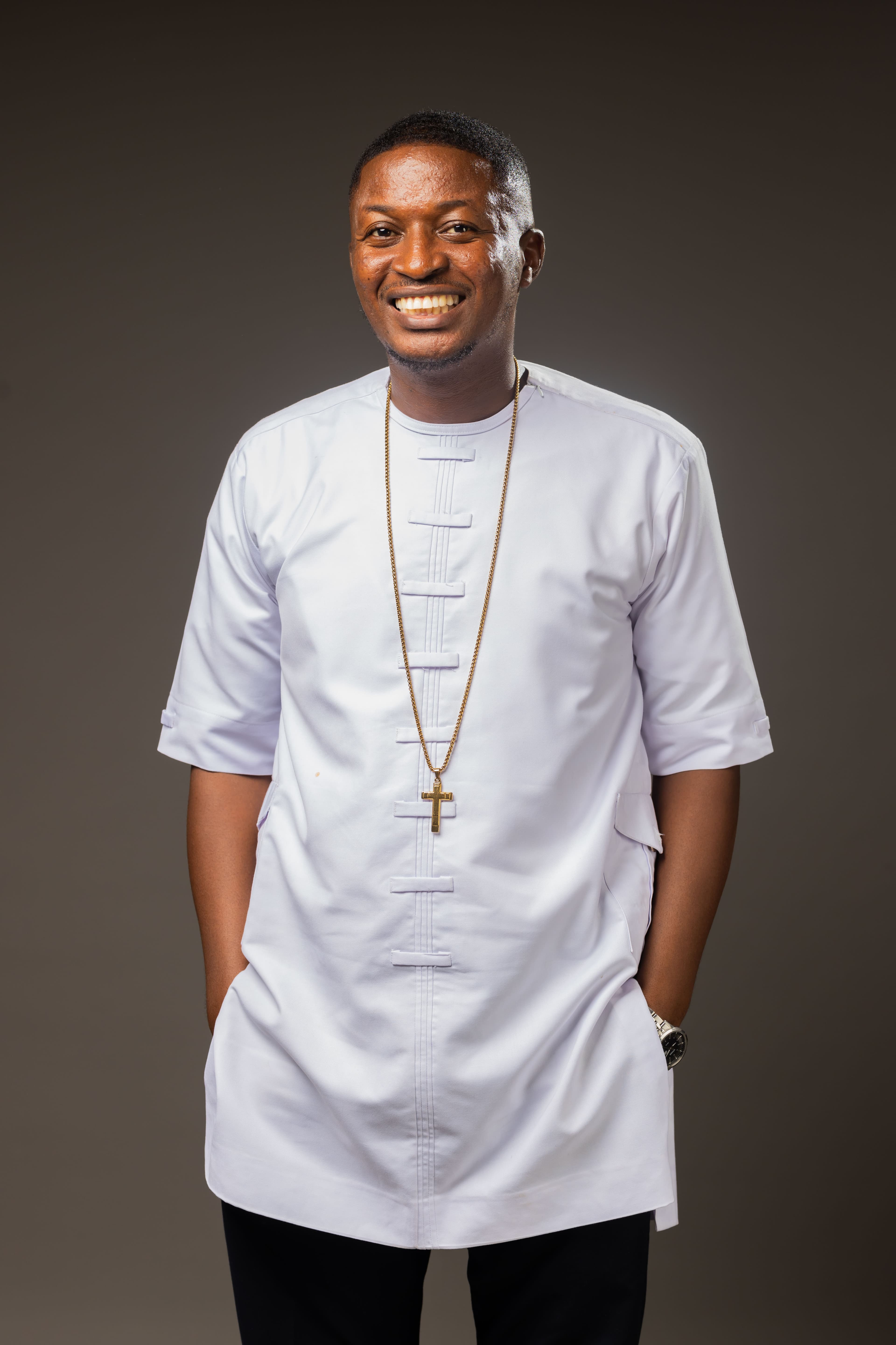 Rev. Theophilus Badger in traditional white attire
