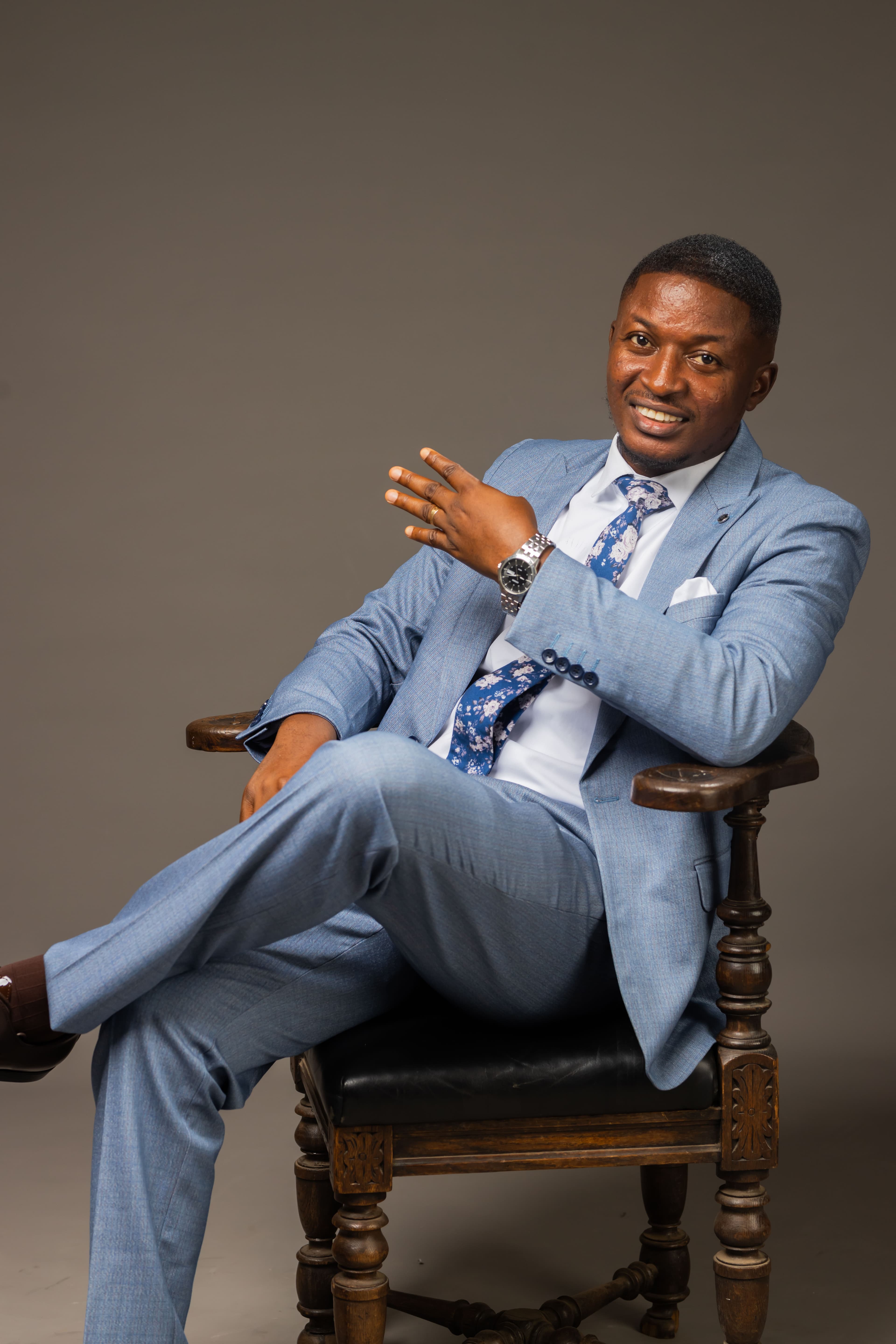 Rev. Theophilus Badger in formal blue suit